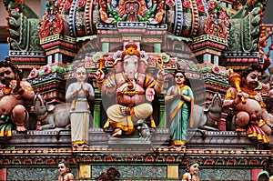 Statue of Ganesh on a colorful indian temple facade