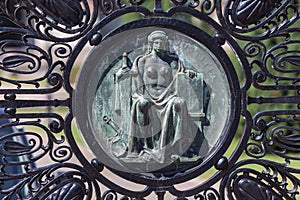 Statue on a gate at the international court of justice freedom palace the hague netherlands