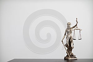 statue of god Themis Lady Justice is used as symbol of justice within law firm to demonstrate truthfulness of facts and power to