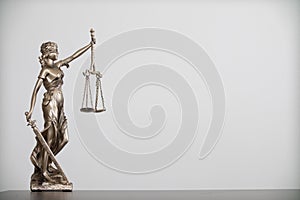 statue of god Themis Lady Justice is used as symbol of justice within law firm to demonstrate truthfulness of facts and power to