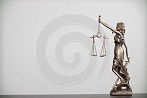 statue of god Themis Lady Justice is used as symbol of justice within law firm to demonstrate truthfulness of facts and power to