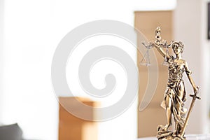 statue of god Themis Lady Justice is used as symbol of justice within law firm to demonstrate truthfulness of facts and power to