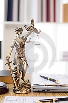 statue of god Themis Lady Justice is used as symbol of justice within law firm to demonstrate truthfulness of facts and power to