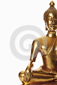 Statue of golden bhudda against white background