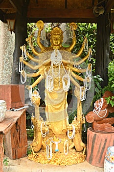 Statue of golden Goddess Kuan Yin Enshrined in Tham Khao Wong Temple.