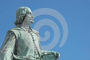 Statue of great scientist Otto von Guericke in historical downtown of Magdeburg Germany, at sunny day and blue sky, closeup,