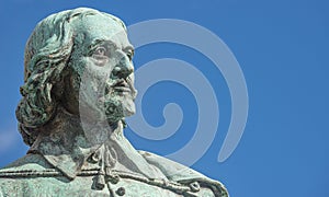 Statue of great scientist Otto von Guericke in historical downtown of Magdeburg Germany, at sunny day and blue sky, closeup,