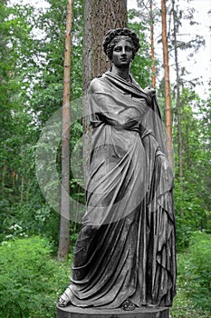Statue of the Greek goddess Flora in the spring park. Determination, strength, power. Matriarchy. Women& x27;s rights