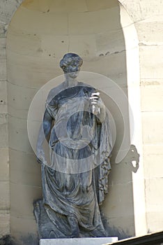 Statue of a Greek woman in an alcove, England