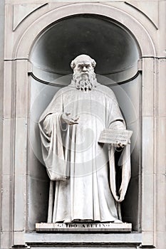 Statue of Guido d'Arezzo in Uffizi Alley in Florence, Italy photo