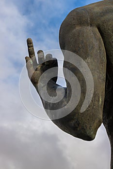 Statue: hand with index finger up, Spain