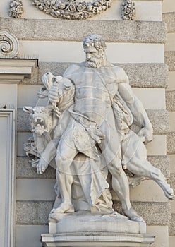 Statue of Hercules capturing Cerberus at the Michaelerplatz entrance to the Michaelertrakt at the Hofburg Palace, Vienna photo