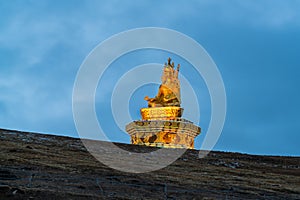 Statue on the hill in Yarchen Gar