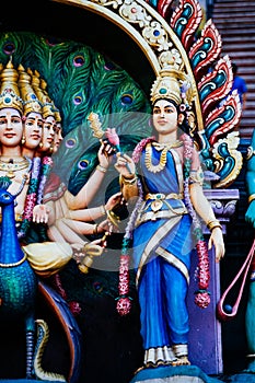 Statue Hindu deities on the roof of temple within Batu Caves. Batu Caves - a complex of limestone caves in Kuala Lumpur, Malesia