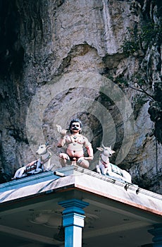 Statue Hindu deities on the roof of temple within Batu Caves. Batu Caves - a complex of limestone caves in Kuala Lumpur, Malesia