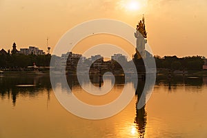 The Statue of Hindu god Lord Shiva in Sursagar Lake is seen at sunset in Vadodara city in the state of Gujarat. Concept of