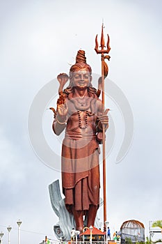 Statue of Hindu God Shiva at the sacred lake of Grand Bassin in the South of the island of Mauritius.
