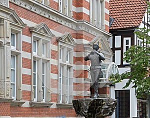Statue and Historical Building in the Old Town of Hamelin, Lower Saxony