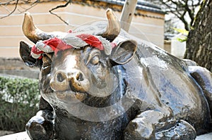The statue of the holy ox at Dazaifu Tenmangu entrance, Fukuoka, Japan photo