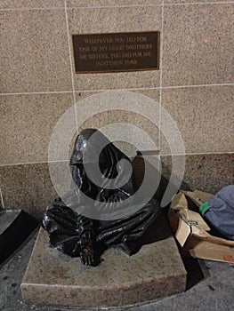 Statue of a homeless beggar.