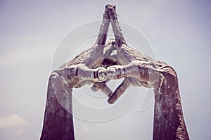 Statue with Interlocked Hands in Park photo