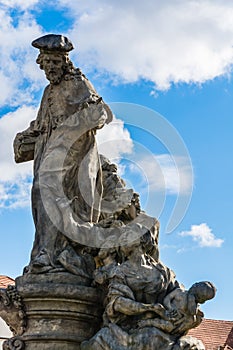 Statue of Ivo of Kermartin on Charles Bridge in Prague photo