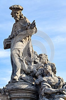 Statue of Ivo of Kermartin on Charles Bridge in Prague photo