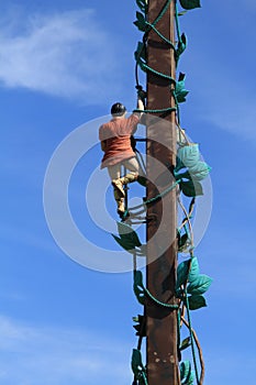 Statue of Jack and his bean stalk with blue sky background.