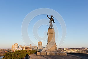 Statue of Jacques Cartier against a blue sky