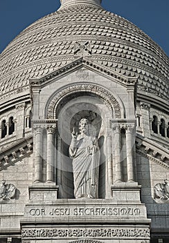 The statue of Jesus on SacrÃ© CÅ“urâ€™s faÃ§ade