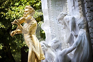 The Statue of Johann Strauss in stadtpark in Vienna, Austria photo