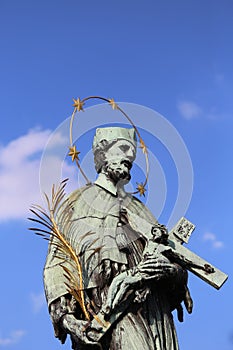 statue of John Nepomucene with crucifix