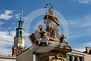 Statue of John of Nepomuk in Poznan, Poland at the Old Square Stary Rynek with the town hall