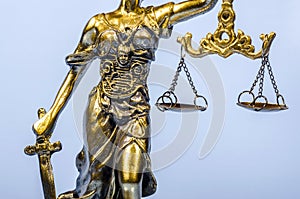 Statue of Justice on the blue background