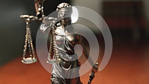 The Statue of Justice - lady justice / Justitia in lawyer office