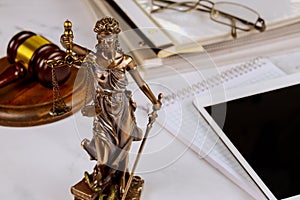 The Statue of Justice symbol, legal law office on a digital tablet