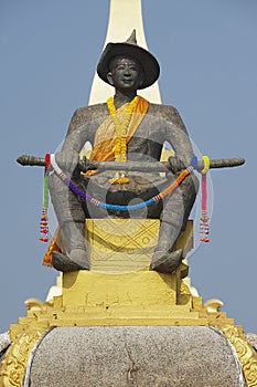 Statue of the King Chao Anouvong in front of the Pha That Luang stupa in Vientiane, Laos.