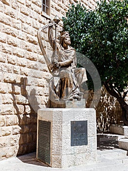 The statue of King David with harp near entrance to his tomb on Mount Zion in Jerusalem, Israel