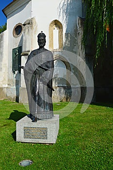 Statue of King Louis I of Hungary with letters of city privileges of Skalica city in his right hand, in front of gothic charnel
