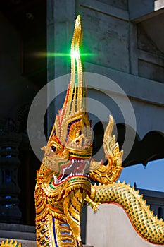 Statue king of nagas in front of buddhism temple