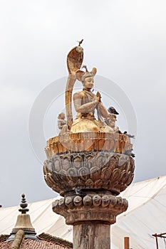 Statue of King Yog Narendra Malla at Patan Durbar Square photo