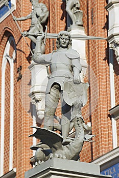 Statue of the knight defeating a dragon in front of the House of Blackheads in Riga, Latvia.