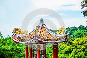 The statue of the Kuan Yin with sky background.