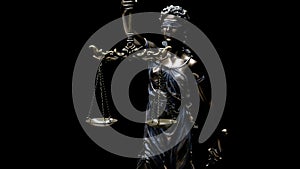 The statue of Lady Justice on a black background. Law theme with Roman goddess of justice