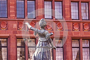 Statue of Lady Justice in front of the Romer in Frankfurt photo