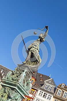 Statue of Lady Justice in front of the Romer in Frankfurt photo