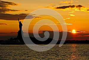 Statue of Liberty against sunset - saturated silhouette