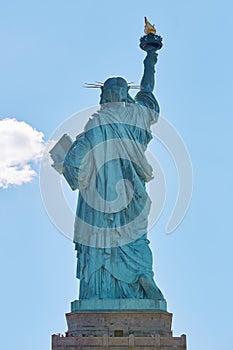 Statue of Liberty back view in New York in a sunny day