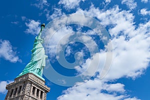 The Statue of Liberty with blue sky and cloud on a sunny day, New York City, USA