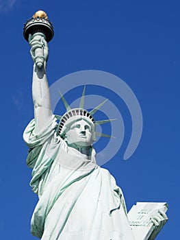 Statue of Liberty with Bright Blue Sky in Background